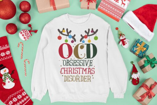 mockup of a crewneck sweatshirt surrounded by christmas decorations and gifts m16